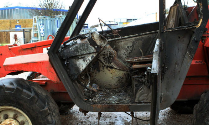 A burnt-out vehicle at the Garden Landscape Company.