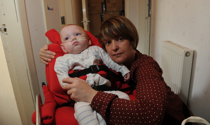 Kane and his mum Emma Bradley at their home in Montrose.