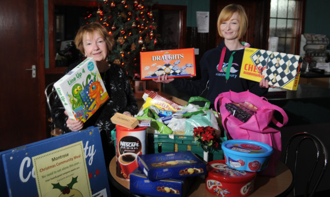 Montrose YMCA manager Val Cooper, left, and youth worker Helen Mearns with some of the items that have been donated.