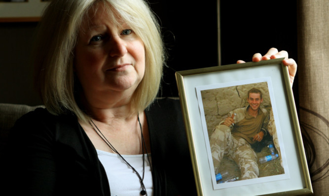 June Black, with her favourite photo of her son Aaron, who committed suicide whilst suffering from Post Traumatic Stress Disorder.