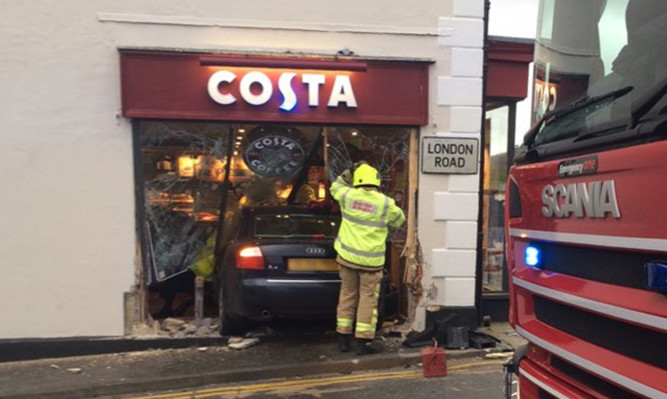 BEST QUALITY AVAILABLE Handout photo taken with permission from the Twitter feed of Sally Pendleton of a car embedded in the front of a Costa coffee store in Westerham, Kent.

PRESS ASSOCIATION Photo. Issue date: Thursday December 24, 2015. See PA story POLICE Costa. Photo credit should read: Twitter / Sally Pendleton/PA Wire

NOTE TO EDITORS: This handout photo may only be used in for editorial reporting purposes for the contemporaneous illustration of events, things or the people in the image or facts mentioned in the caption. Reuse of the picture may require further permission from the copyright holder.
