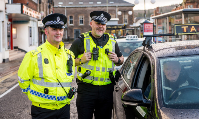 From left: 

Sgt Scott Ferguson and Sgt John Thompson  chatting to the taxi drivers in Perth.