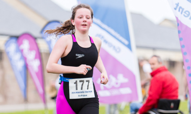 Heather Ingram sealed a win in the youth female category in the 2014 Montrose Triathlon.