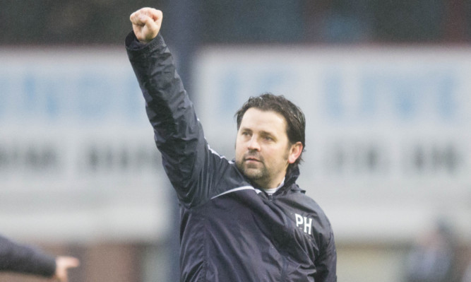 Paul Hartley salutes the home fans.