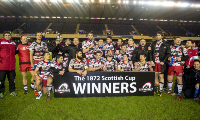 Edinburgh's squad celebrate after winning the 1872 Cup at Murrayfield.