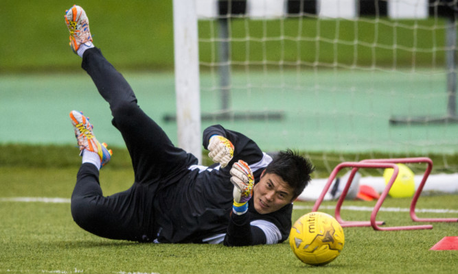 Eiji Kawashima gets put through his paces in training.