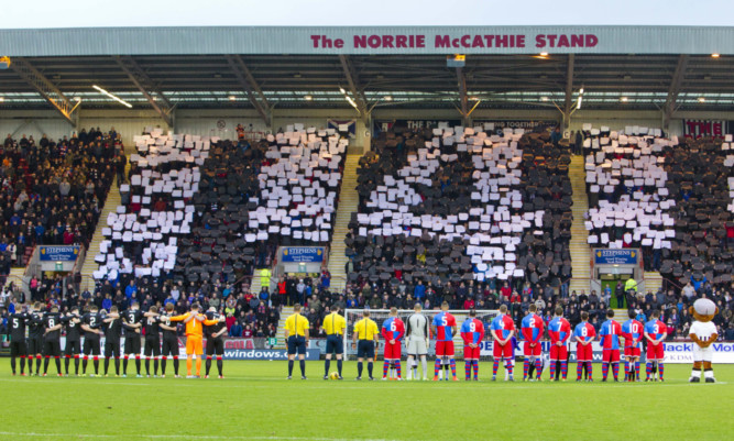 Dunfermline players and supporters pay their respects to club legend Norrie McCathie.