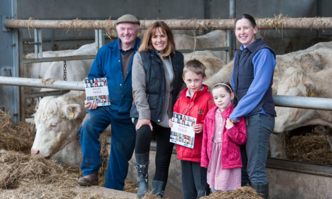 Carol at Ross Farm with Ronnie Mackie, his daughter-in-law Rebecca and grandchildren Wallace and Catrina.