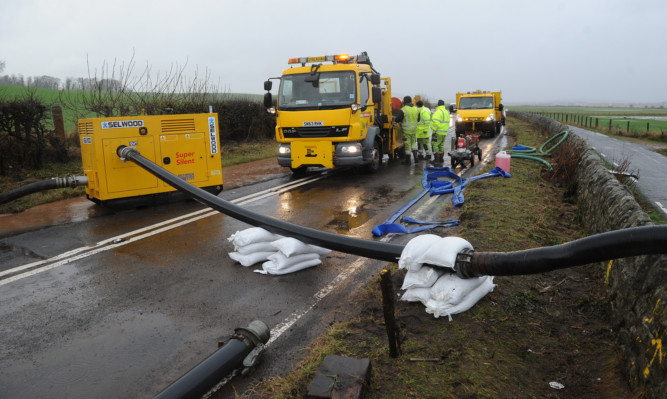 Council workers have cleared water which closed the road from Guardbridge to St Andrews.