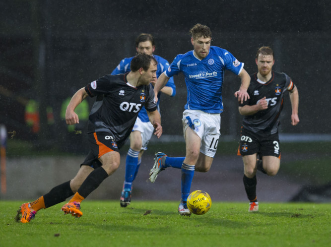 Kilmarnock's Conrad Balatoni launches in to tackle St Johnstone's David Wotherspoon.