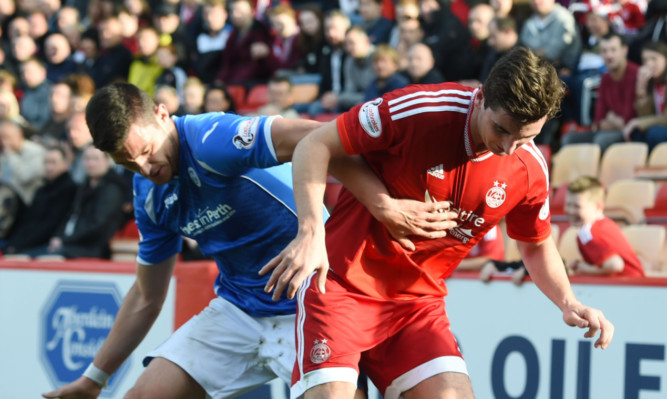 St Johnstone's Steven MacLean battles for the ball against Aberdeen's Kenny McLean the last time the teams met.