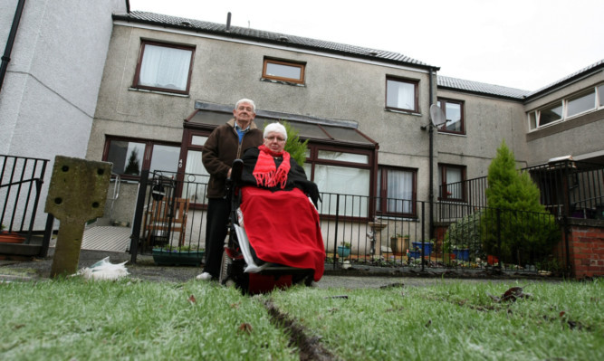 Pensioners William Hunter and his wife Louisa outside their Forfar home.