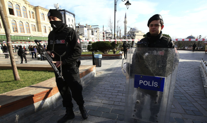 Policemen secure an area at the historic Sultanahmet district, which is popular with tourists, after an explosion in Istanbul.