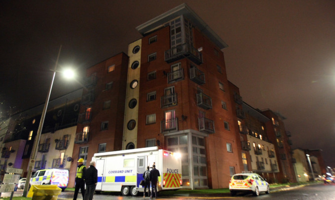 Police co-ordinating the evacuation of the Gourlay Yard flats.