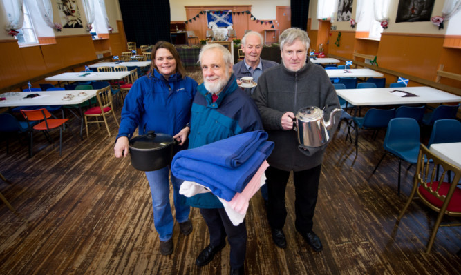 From left: volunteer Kirsty Cohen, Community Resilience Group co-ordinator Stewart MacGlashan, volunteer John Cameron and community council chairman Donald Isley.