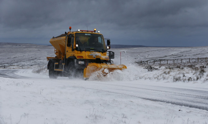 A snow plough clears Snow in Northumnerland on the road between Allendale and Nenthead .....PA Photo Owen Humphreys