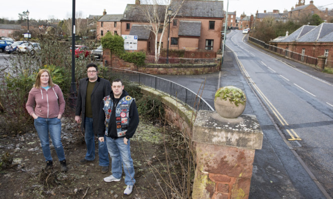 Jayne Grewar, Graham Galloway and John Crawford pictured where the Bon Scott statue will be situated at the Bellies Brae car park.