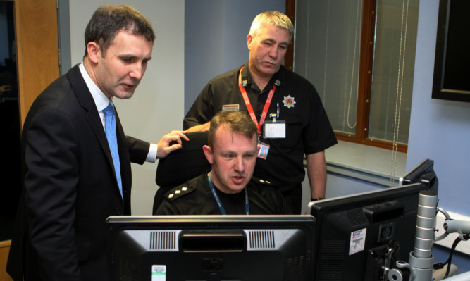 Justice Secretary Michael Matheson with Chief Inspector David McIntosh and Colin Grieve from Scottish Fire & Rescue Service.