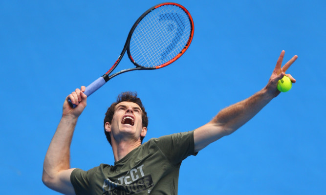 Andy Murray  serves during a practice session ahead of the Australian Open.