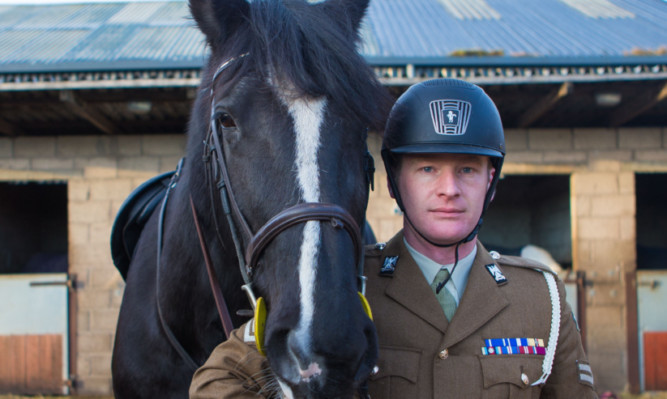 The Royal Scots Dragoon Guards mascot and drum horse 'Talavera' with regimental groom Lance Corporal Calum Jones