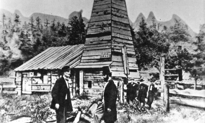 Colonel Edwin Laurentine Drake (1819-1880), in top hat, talks to an engineer at his oil well at Titusville, Pennsylvania.
