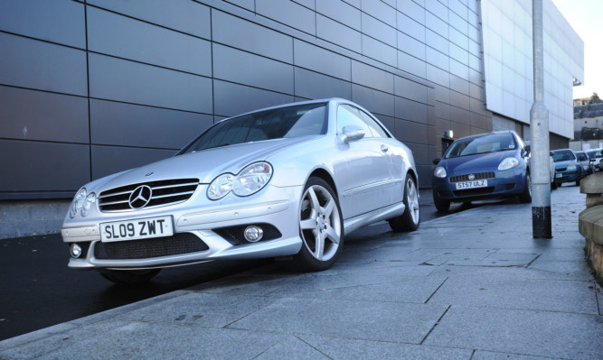 Cars mounted on the pavement outside the Kirkcaldy Leisure Centre.