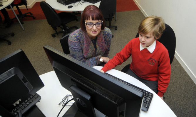 Scottish Education Secretary Angela Constance with Fraser Gray, 11, from Monikie Primary School.