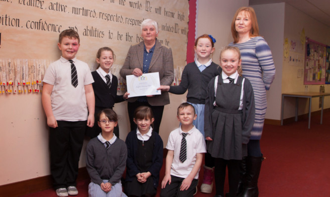 Councillor Jeanette Gaul, chairman of the Pride in Place member officer group, with primary three and four pupils and teacher Susan Grant.