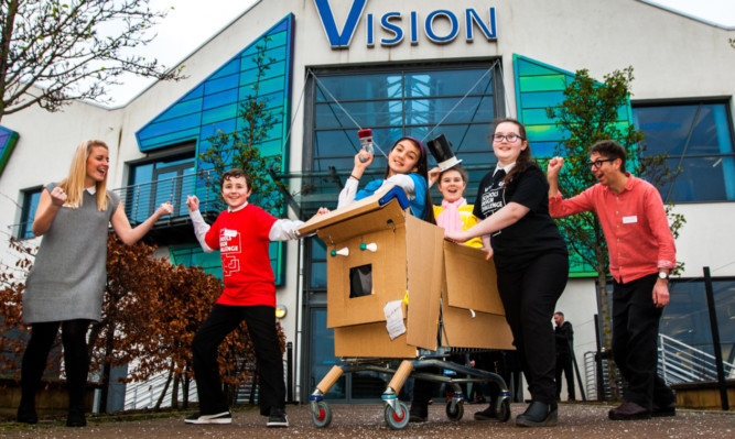 Pupils from St Pauls RC Academy and their anti-bullying robot. From left: teacher Amy Barber, Connor Hepburn, Aniela Reszcyriski, Oriana Derylo, Abbie ONeill and interaction designer Graham Pullin.