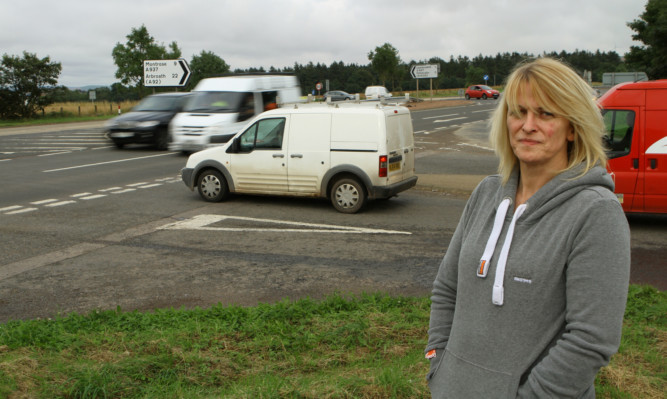 Jill Fotheringham beside the busy A937 crossing on the A90 at Laurencekirk.