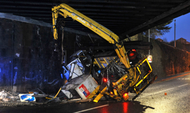 The lorry became wedged under the bridge near Perth Railway Station.