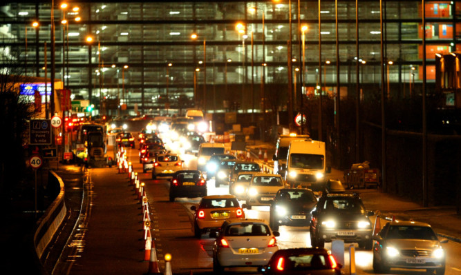 Traffic is reduced to one lane each way as the gas main repair work takes place on either side of East Dock Street.