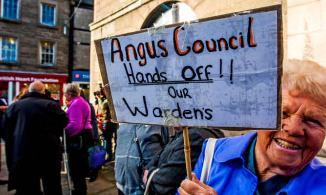 Campaigners protest against the wardens proposal outside Town and County Hall, Forfar.