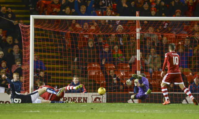Adam Rooney (second from left) opens the scoring for Aberdeen.