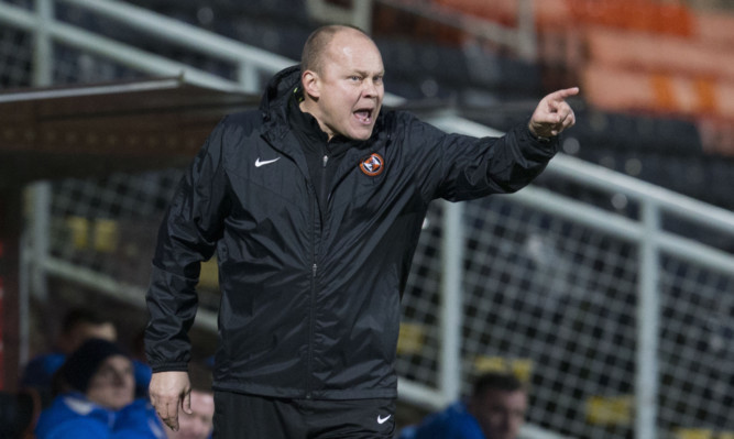 Mixu Paatelainen gives instructions to his player.