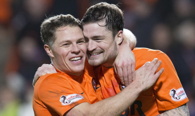 Joy at the final whistle for John Rankin (left) and Paul Paton.