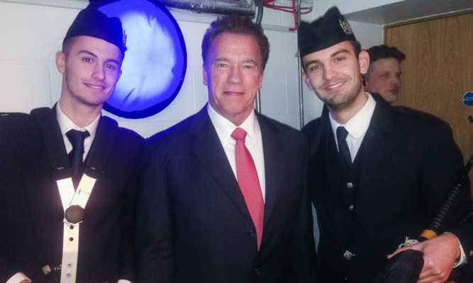 Craig Weir, right, and brother Paul with Arnold Schwarzenegger at the EICC.
