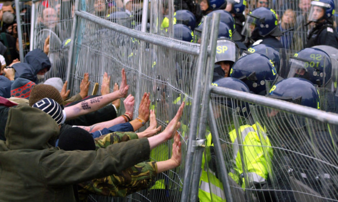 Protesters clash with police during the G8 summit at Gleneagles in 2005.