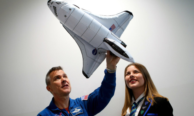 Former space shuttle pilot Flight Lieutenant Duane 'Digger' Carey talking to Hazel Barlow of Auchmuty High School, Glenrothes, during a visit to Fife last year