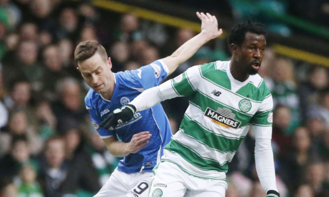 Steven MacLean battles for possession with Efe Ambrose.