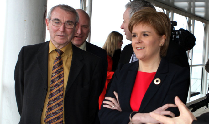 Dundee Council leader Ken Guild with First Minister Nicola Sturgeon. Jenny wants to know why is he not protesting more to her about council budget cuts.