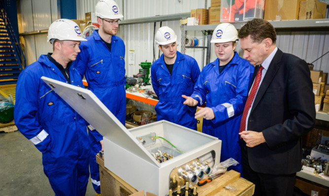 DPS group apprentices Connor Ferguson, Harry Clark, Callum Snowden, Fraser Neilson show Murdo Fraser around.