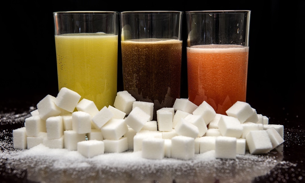 File photo dated 22/07/15 of carbonated drinks surrounded by sugar cubes. The World Health Organisation (WHO) has joined those calling for a "sugar tax" on soft drinks in a major report on childhood obesity. PRESS ASSOCIATION Photo. Issue date: Monday January 25, 2016. The move will undoubtedly increase pressure on the Government as it prepares to issue its own strategy for tackling obesity in the UK. See PA story HEALTH Sugar. Photo credit should read: Anthony Devlin/PA Wire