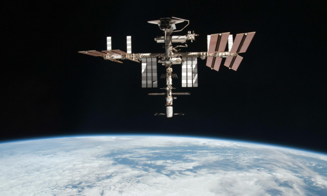 A file photo released by NASA showing the International Space Station at an altitude of approximately 220 miles above the Earth.
