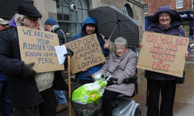 Dave Coull, Ann Hyslop, Jean Richardson and Margaret Allan of Angus Against Cuts during a protest outside a meeting of Angus Council in December.