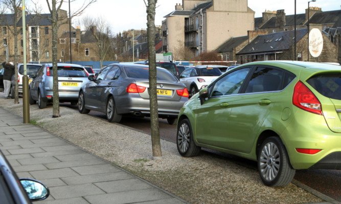 Cars parked on pavements near Clepington Primary School in Dundee.