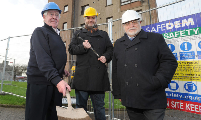 Councillors Dave Lumgair, Donald Morrison and Alex King outside some of the flats to be demolished.