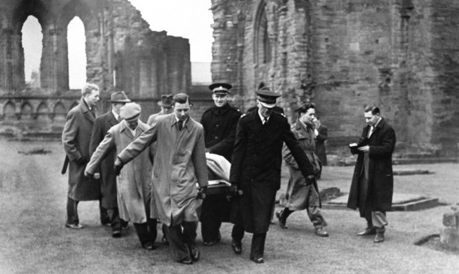 The Stone of Destiny being removed from Arbroath Abbey after the students' audacious stunt.