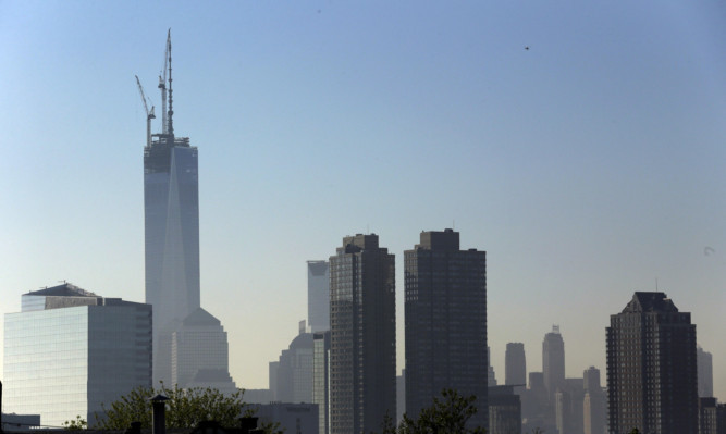 One World Trade Center stands at its full height above the New York City skyline.