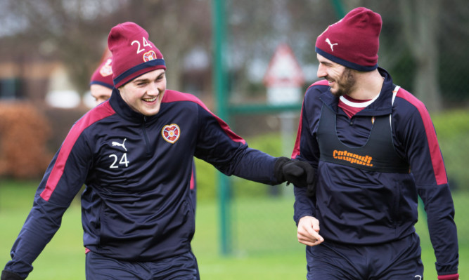 John Souttar, left, enjoys a laugh with Hearts team-mate Callum Paterson at training.
